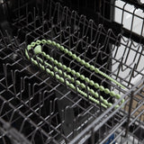 The Silicone Accessory Tether 2-Pack in Sage by Bumkins is safely nestled in the dishwashers open top rack.