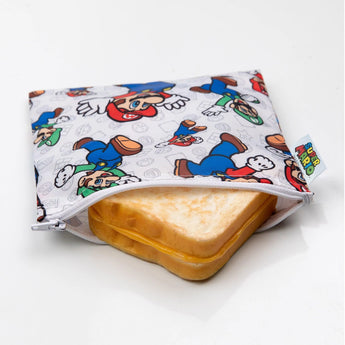 Bumkins Super Mario™ & Luigi reusable snack bag keeps your grilled cheese safe with its vibrant design and waterproof fabric.