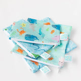 Bumkins Reusable Snack Bag 2-Pack: Vibrant ocean life designs with whales, crabs, and fish; each pouch has a durable zipper.