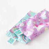 Bumkins Reusable Snack Bag 2-Pack: Waterproof pouches with zippers in pink unicorns and blue rainbows.