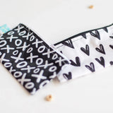 Bumkins small 2-pack reusable snack bags feature XOXO and heart patterns. Made from waterproof, machine-washable fabric.