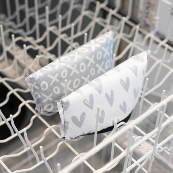 Two durable, waterproof Bumkins snack bags in XOXO & Hearts designs are machine washable and small enough for a dishwasher.