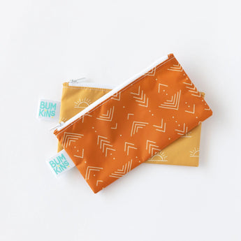 The Bumkins Reusable Snack Bag, Small 2-Pack includes Sunshine & Grounded prints, made from waterproof fabric.