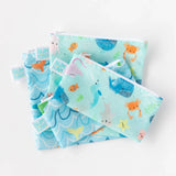 Bumkins offers a 2-pack of reusable snack bags featuring ocean life designs in durable blue and green waterproof fabric.