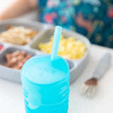 Bumkins Silicone Straw Cup with Lid in blue, LFGB-grade silicone, is perfect for honing independent drinking skills.