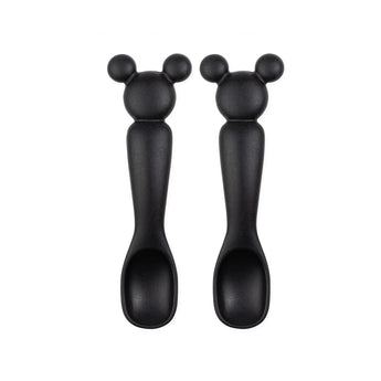 Two Mickey Mouse (Classic Black) silicone dipping spoons from Bumkins, arranged vertically on a food-safe silicone mat.