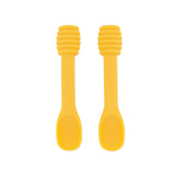 Two Bumkins Silicone Dipping Spoons: Winnie the Pooh lie side by side on a white background, featuring ribbed handles for self-feeding.