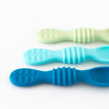 Bumkins Silicone Dipping Spoons (3 Pack: Gumdrop) in blue and green shades parallel on white surface.