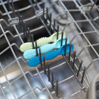 The Gumdrop Silicone Dipping Spoons 3 Pack by Bumkins, in blue and green, fits neatly in your dishwasher. Food-safe silicone.