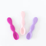 Bumkins Silicone Dipping Spoons 3 Pack: Lollipop in pink, light pink, and purple help babies with self-feeding.