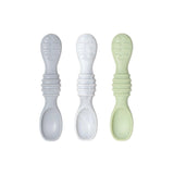 Three Silicone Dipping Spoons by Bumkins in gray, white, and light green are laid out on a white background.