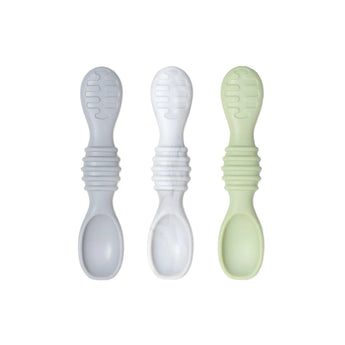 Three Silicone Dipping Spoons by Bumkins in gray, white, and light green are laid out on a white background.