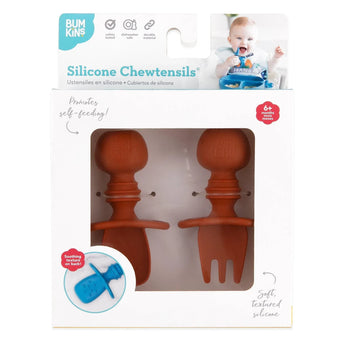 Packaging of Bumkins Silicone Chewtensils®: Clay shows a baby using the red spoon and fork, made from food-safe silicone.