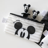 Bumkins Silicone Chewtensils®: Mickey Mouse comes with a white and black zippered pouch featuring fun character-shaped zipper pulls.