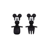 Two black Silicone Chewtensils®: Mickey Mouse stoppers from Bumkins, featuring cartoon mouse heads with a spoon and fork—great for weaning!.