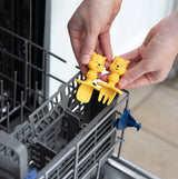 Placing Bumkins Winnie The Pooh Silicone Chewtensils® in the dishwashers cutlery rack, ideal for baby-led weaning.