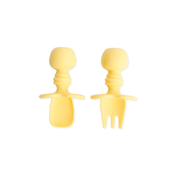 Bumkins Silicone Chewtensils®: Pineapple—two yellow food-safe silicone baby utensils, spoon & fork with easy-grip handles on a white background.