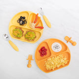 Two Silicone Chewtensils®: Tangerine by Bumkins with 2 divided yellow plates for scrambled eggs, avocado, and fruit. Perfect for baby-led weaning.