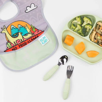 A llama bib, Bumkins Spoon + Fork: Sage set, and a self-feeding plate with pasta, broccoli, melon on white.