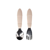 The Bumkins Spoon + Fork: Sand, made from food-safe silicone, features beige textured handles and is displayed on a white background.