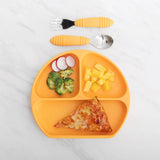 Yellow divided plate with pizza, broccoli, radish, pineapple; Bumkins Spoon + Fork: Tangerine for toddlers on marble surface.