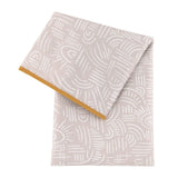 The Splat Mat: Wander by Bumkins is a light grey, waterproof, machine washable mat with abstract white patterns and a yellow edge.