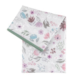 Bumkins Splat Mat: Floral, features pastel flowers with a green edge. Durable, waterproof fabric for easy cleaning.