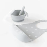 Bumkins Silicone Bib: Hearts, grey with a catch-all pocket, matching bowl set, made from food-safe silicone on a white background.