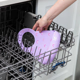 Placing a Bumkins Silicone Bib: Rainbows in the dishwasher, tackling mealtime mess and ensuring baby safety.