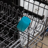 The Bumkins Silicone Starter Cup, Small Blue, is placed upside down on the dishwashers top rack.