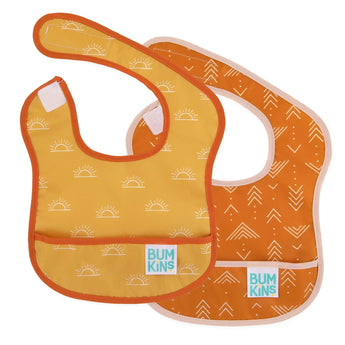 Two orange Bumkins Starter Bibs featuring sun and arrow designs, part of the Desert Boho collection.