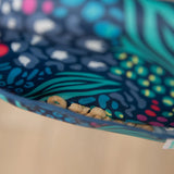 Inside view of Bumkins Starter Bibs with oat rings, made from safety-tested, waterproof fabric in Jungle & Animal prints.