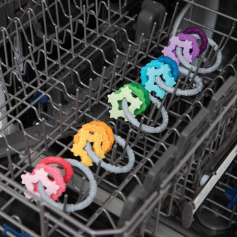 Bumkins Silicone Teething Charms in Purple are 100% food-safe and top-rack dishwasher-safe for easy cleaning.