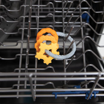 Silicone Teething Charms: Orange by Bumkins offer teething relief and are top rack dishwasher safe for easy cleaning.