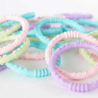 Bumkins Silicone Teething Rings Spring 4 Pack: Pastel textured silicone to soothe sore gums.