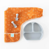 Sleeved Bib: Grounded, baby utensils, and gray divided plate from Bumkins Desert Boho collection on a white background.