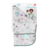 The Bumkins Sleeved Bib: Floral, for 6-24 months, features waterproof fabric and comes with a display card showing a smiling child. Ideal for weaning.