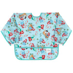 The Sleeved Bib: Ariel by Bumkins features colorful mermaids, sea creatures, and ocean-themed illustrations on a light blue background with green trim, perfect for baby-led weaning.