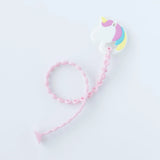 Bumkins Silicone Teether: Unicorn is a pastel pacifier clip on a pink chain, featuring non-toxic, unicorn-shaped beads for style and safety.