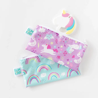 Two non-toxic zippered pouches with unicorn, rainbow, and cloud designs on white; includes a Bumkins Silicone Teether: Unicorn.