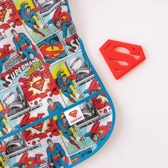 Bumkins Superman-themed fabric features comic strips with various poses, a red emblem, and a fun silicone teether.