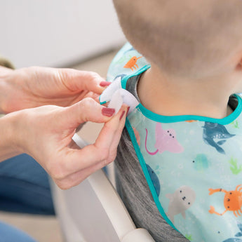 The Bumkins Junior Bib: Ocean Life offers an adjustable, waterproof fit for sea-themed adventures.