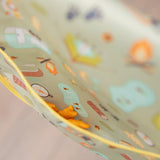 Close-up of a reusable snack bag with a camping print, filled with goldfish crackers—great for adventures with Bumkins Junior Bib: Camp Gear.