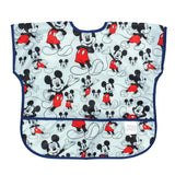 Bumkins Junior Bib: Mickey Mouse Classic features a light blue background with Mickey illustrations, easy-wipe fabric, and a pocket.