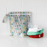 Bumkins Wet Bag: Cacti, crafted from waterproof fabric, holds cloth diapers in green/red and breast pump parts.