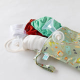 The Bumkins Wet Bag: Camp Gear, in a woodland theme, features waterproof fabric, a handle, and a zipper, perfect for diapers and pumps.