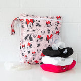 Bumkins Wet Bag: Minnie Mouse Classic features waterproof fabric, fits a breast pump and three cloth diapers, ideal for travel.