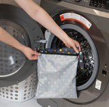 Putting a Bumkins Wet Bag: Super Mario™ Lineup in a front-loading washer.